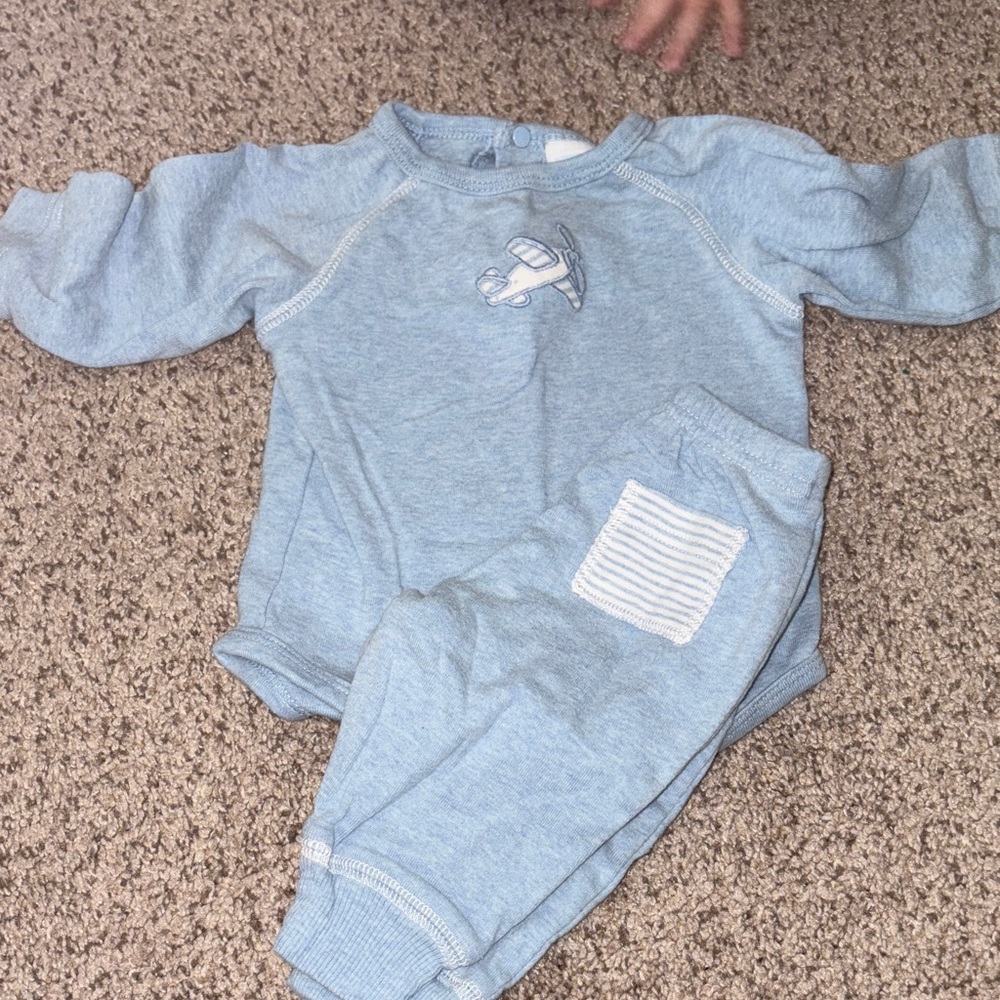 Amy coe. Blue Baby Outfit with Airplane Design